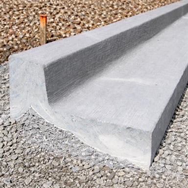 Concrete curb on gravel construction site